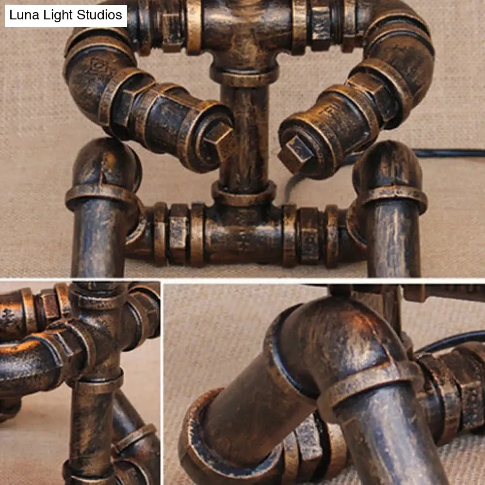 Vintage Stylish Sitting Robot Wrought Iron Table Lamp with Antique Brass Plumbing Pipe